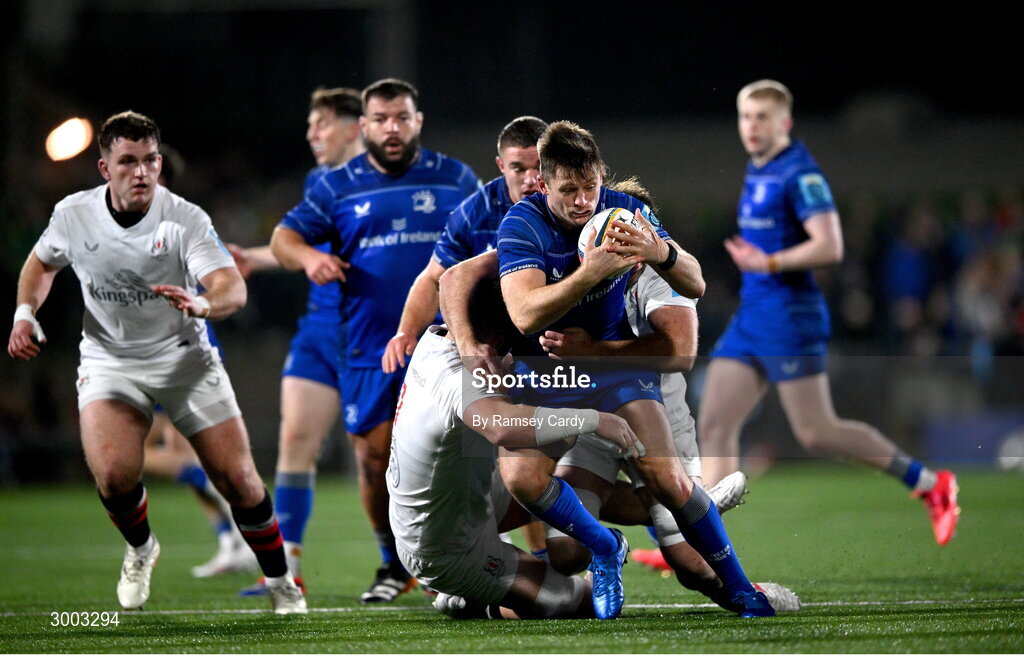 29 November 2024; Ross Byrne of Leinster is tackled by Nick Timoney of Ulster during the United Rugby Championship match between Ulster and Leinster at Kingspan Stadium in Belfast. Photo by Ramsey Cardy/Sportsfile