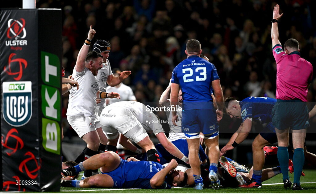 29 November 2024; Ulster players celebrate their side's second try, scored by teammate Ben Carson, hidden, during the United Rugby Championship match between Ulster and Leinster at Kingspan Stadium in Belfast. Photo by Seb Daly/Sportsfile