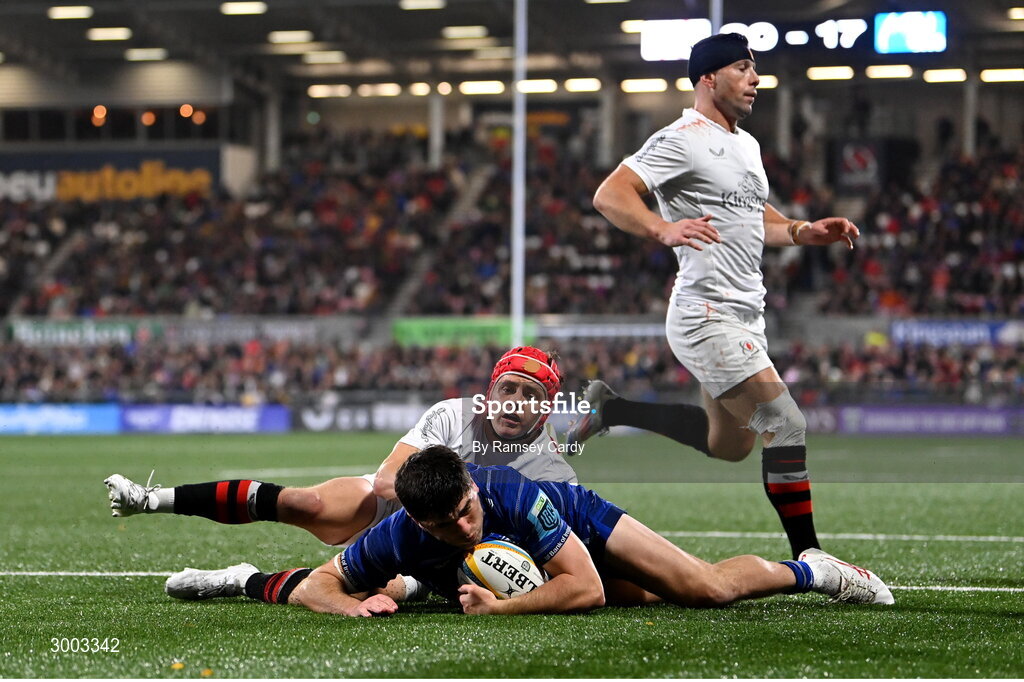 29 November 2024; Jimmy O'Brien of Leinster dives over to score his side's third try despite the attention of Michael Lowry of Ulster during the United Rugby Championship match between Ulster and Leinster at Kingspan Stadium in Belfast. Photo by Ramsey Cardy/Sportsfile