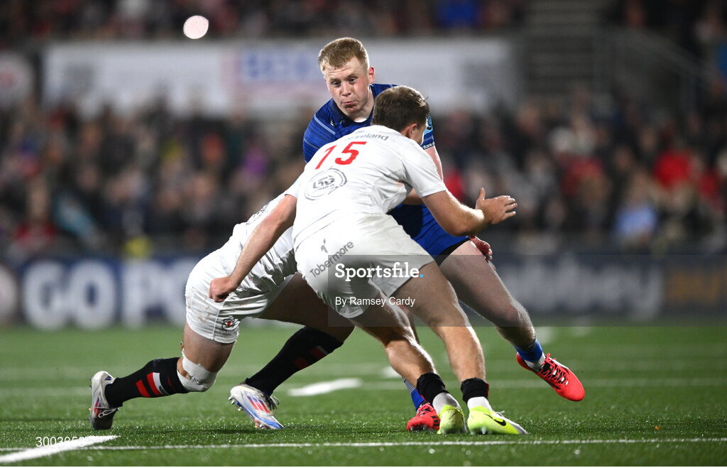 29 November 2024; Andrew Osborne of Leinster is tackled by John Cooney and Stewart Moore of Ulster during the United Rugby Championship match between Ulster and Leinster at Kingspan Stadium in Belfast. Photo by Ramsey Cardy/Sportsfile