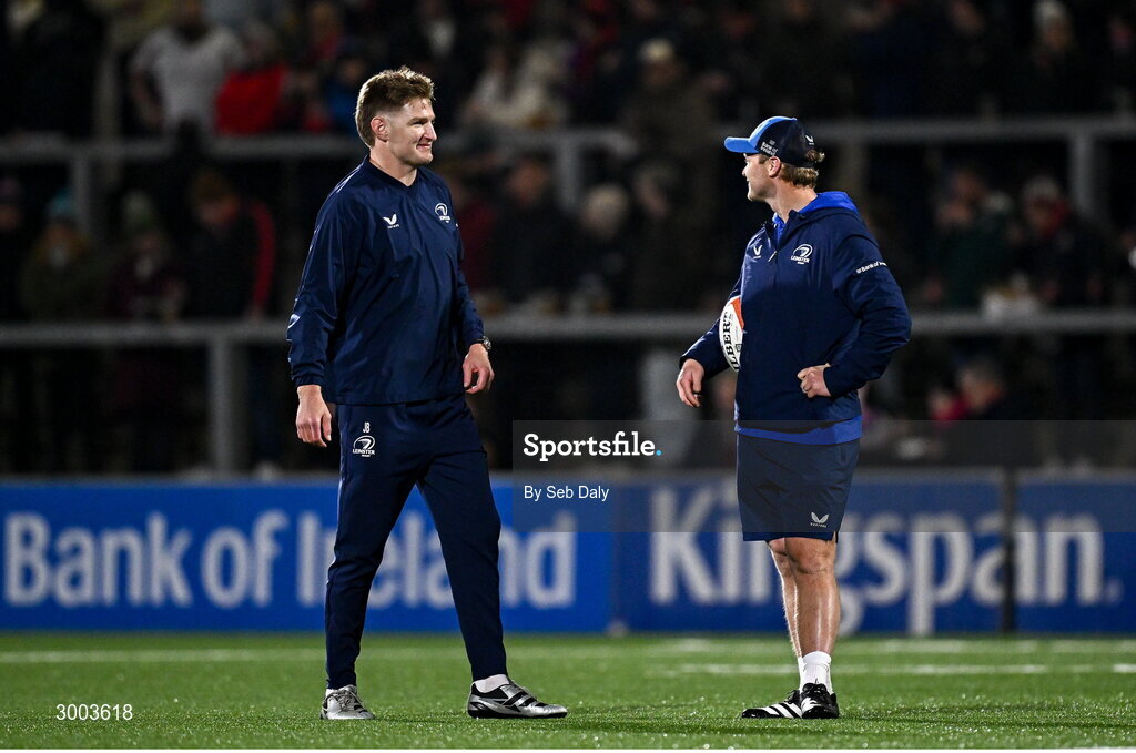 29 November 2024; Leinster's Jordie Barrett, left, and assistant coach Tyler Bleyendaal before the United Rugby Championship match between Ulster and Leinster at Kingspan Stadium in Belfast. Photo by Seb Daly/Sportsfile