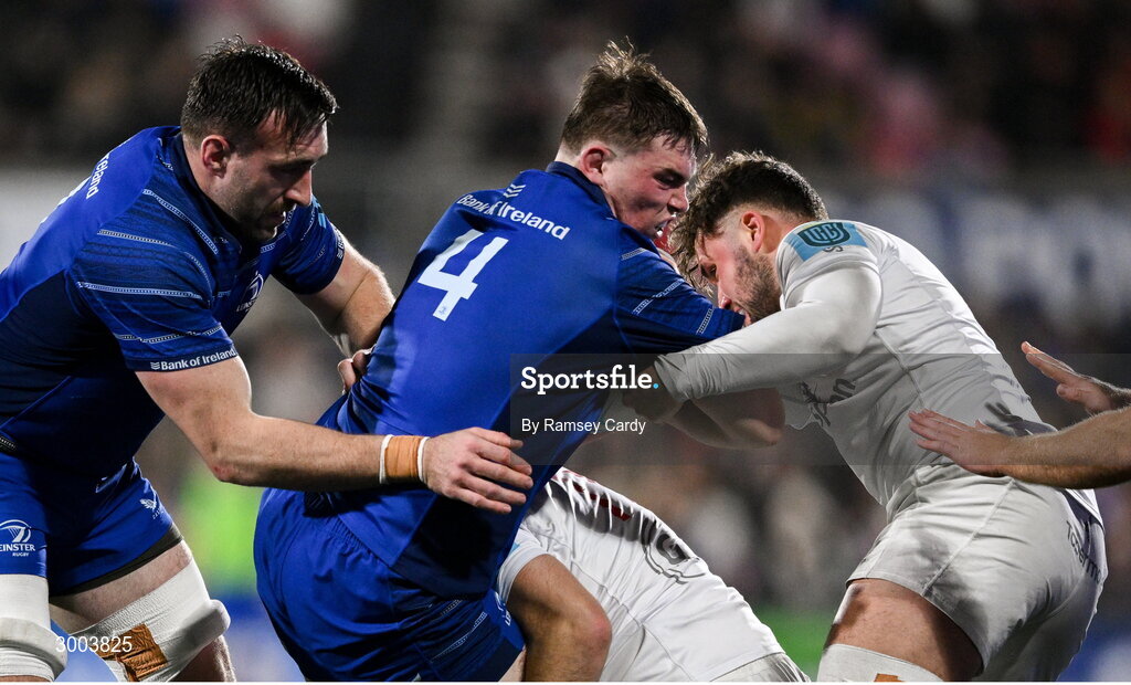 29 November 2024; Diarmuid Mangan of Leinster, supported by Jack Conan, is tackled by Michael Lowry, centre, and Ben Carson of Ulster during the United Rugby Championship match between Ulster and Leinster at Kingspan Stadium in Belfast. Photo by Ramsey Cardy/Sportsfile