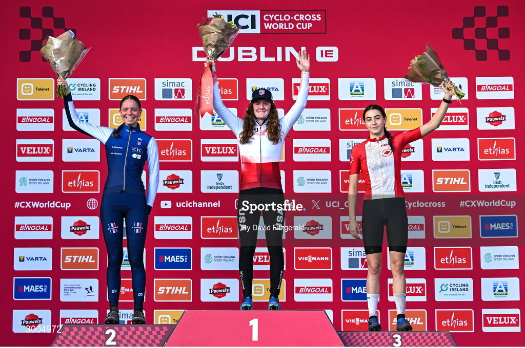 1 December 2024; On the podium after the women's U19 race, race winner Lidia Cusack of USA, centre, second place Lison Desprez of France, left, and third place Rafaelle Carrier of Canada, at the UCI Cyclo-cross World Cup on the Sport Ireland Campus in Dublin. Photo by David Fitzgerald/Sportsfile