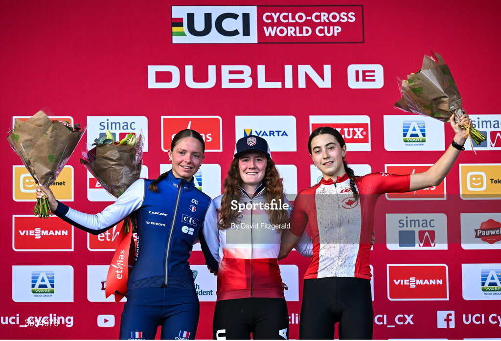 1 December 2024; On the podium after the women's U19 race, race winner Lidia Cusack of USA, centre, second place Lison Desprez of France, left, and third place Rafaelle Carrier of Canada, at the UCI Cyclo-cross World Cup on the Sport Ireland Campus in Dublin. Photo by David Fitzgerald/Sportsfile