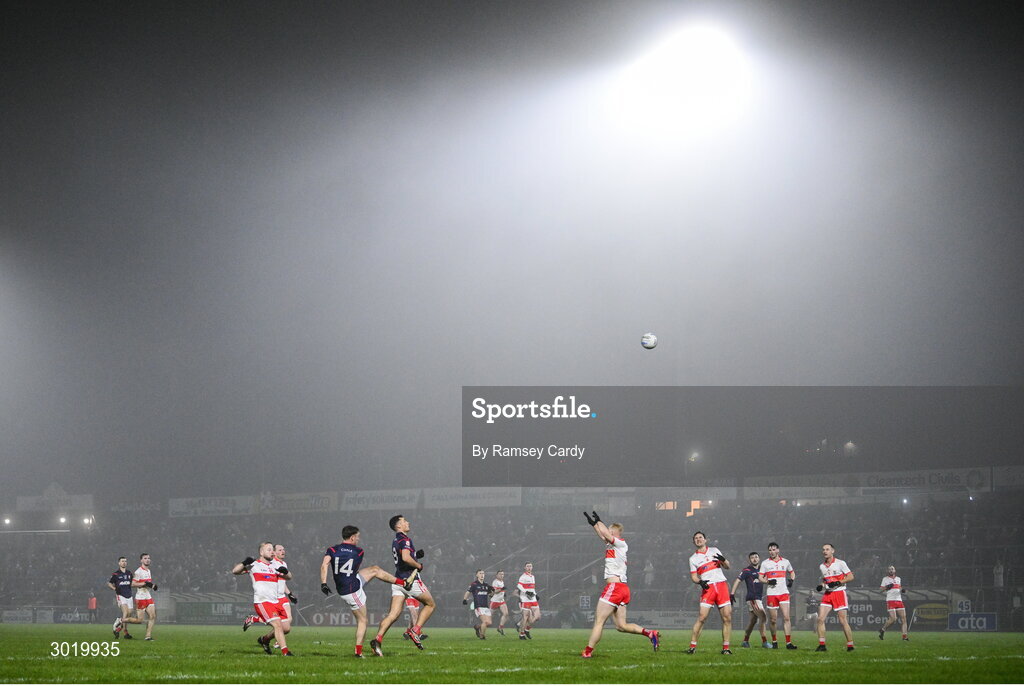11 January 2025; Niall O'Callaghan of Cuala kicks a point under pressure from Sean Taylor of Coolera-Strandhill during the AIB GAA Football All-Ireland Senior Club Championship semi-final match between Coolera-Strandhill and Cuala at Kingspan Breffni Park in Cavan. Photo by Ramsey Cardy/Sportsfile