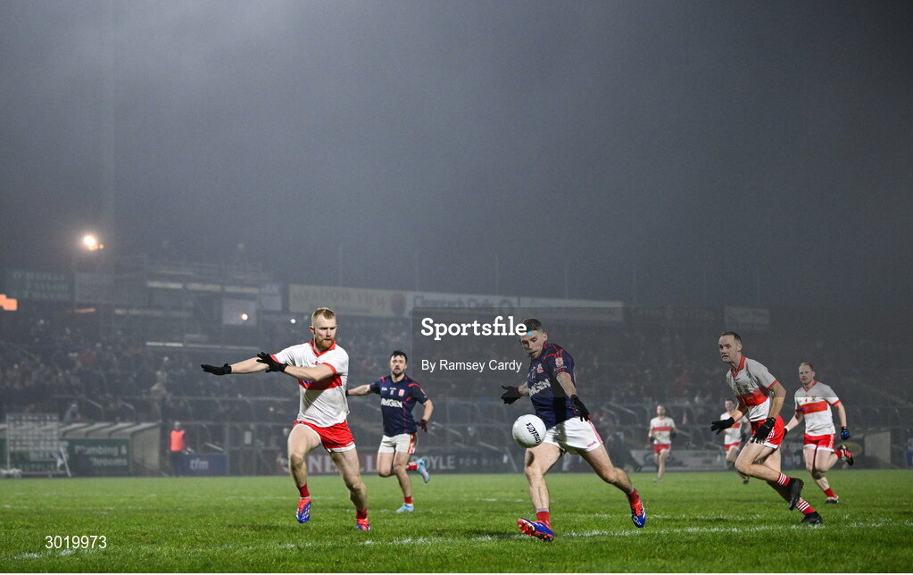 11 January 2025; Luke Keating of Cuala shoots at goal under pressure from Sean Taylor of Coolera-Strandhill during the AIB GAA Football All-Ireland Senior Club Championship semi-final match between Coolera-Strandhill and Cuala at Kingspan Breffni Park in Cavan. Photo by Ramsey Cardy/Sportsfile