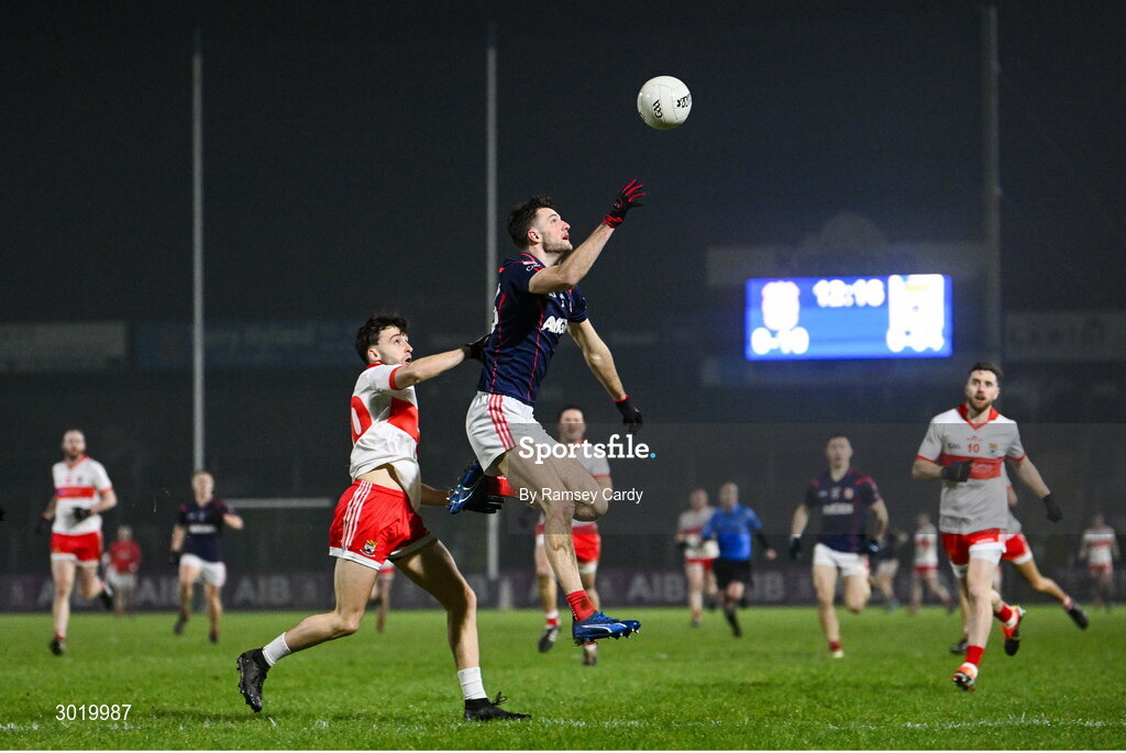 11 January 2025; Cillian Dunne of Cuala in action against Adam Higgins of Coolera-Strandhill during the AIB GAA Football All-Ireland Senior Club Championship semi-final match between Coolera-Strandhill and Cuala at Kingspan Breffni Park in Cavan. Photo by Ramsey Cardy/Sportsfile