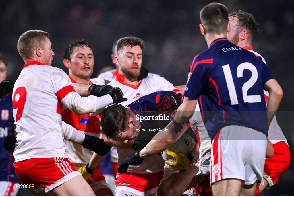 11 January 2025; Peadar Ó Cofaigh Byrne of Cuala under pressure from Coolera-Strandhill players during the AIB GAA Football All-Ireland Senior Club Championship semi-final match between Coolera-Strandhill and Cuala at Kingspan Breffni Park in Cavan. Photo by Ramsey Cardy/Sportsfile