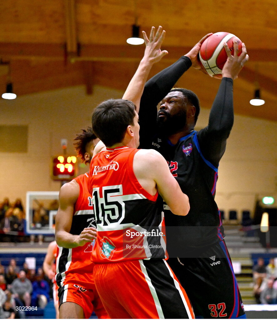 18 January 2025; Elijah Tillman of UCC Demons in action against Ciaran Roe of Killester during the Basketball Ireland Men's Pat Duffy National Cup final match between Killester and UCC Demons at the National Basketball Arena in Tallaght, Dublin. Photo by Shauna Clinton/Sportsfile