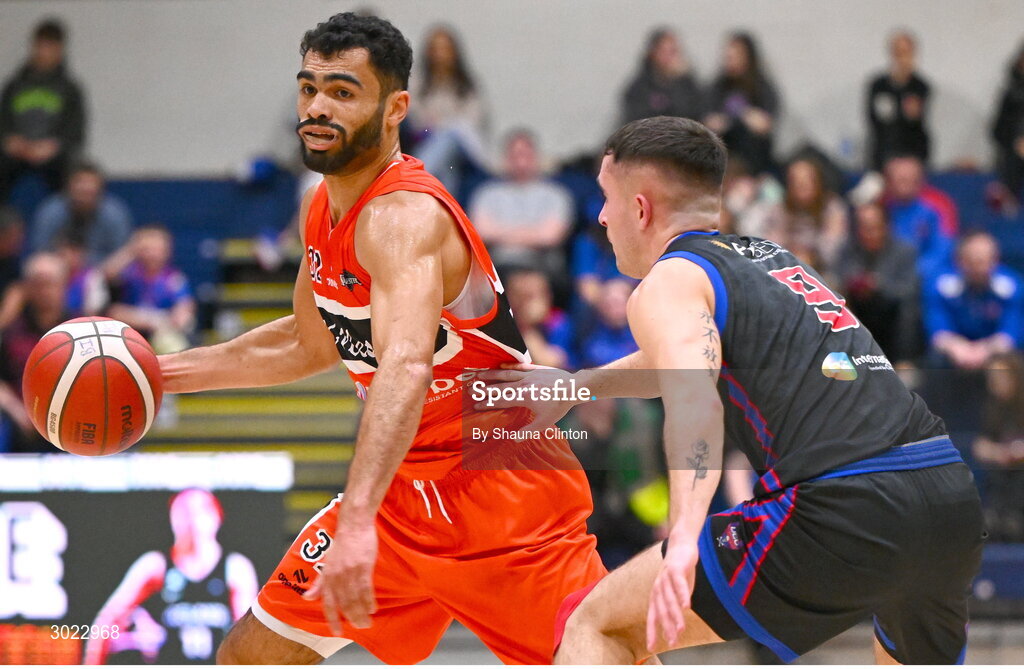 18 January 2025; Kason Harrell of Killester in action against Kyle Hosford of UCC Demons during the Basketball Ireland Men's Pat Duffy National Cup final match between Killester and UCC Demons at the National Basketball Arena in Tallaght, Dublin. Photo by Shauna Clinton/Sportsfile