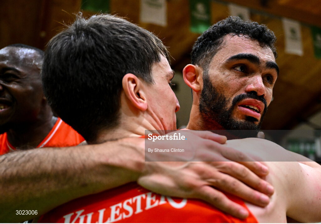 18 January 2025; Isiah Dasher of Killester, right, celebrates with team-mate Ciaran Roe after their side's victory in the Basketball Ireland Men's Pat Duffy National Cup final match between Killester and UCC Demons at the National Basketball Arena in Tallaght, Dublin. Photo by Shauna Clinton/Sportsfile