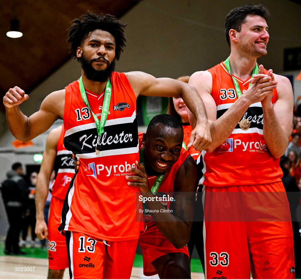 18 January 2025; Isiah Dasher of Killester, left, celebrates with team-mates after their side's victory in the Basketball Ireland Men's Pat Duffy National Cup final match between Killester and UCC Demons at the National Basketball Arena in Tallaght, Dublin. Photo by Shauna Clinton/Sportsfile