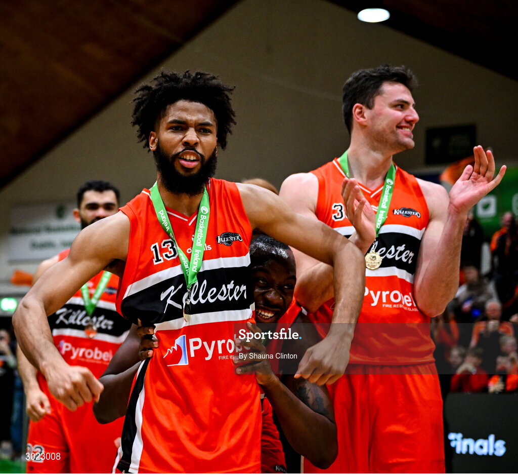 18 January 2025; Isiah Dasher of Killester, left, celebrates with team-mates after their side's victory in the Basketball Ireland Men's Pat Duffy National Cup final match between Killester and UCC Demons at the National Basketball Arena in Tallaght, Dublin. Photo by Shauna Clinton/Sportsfile