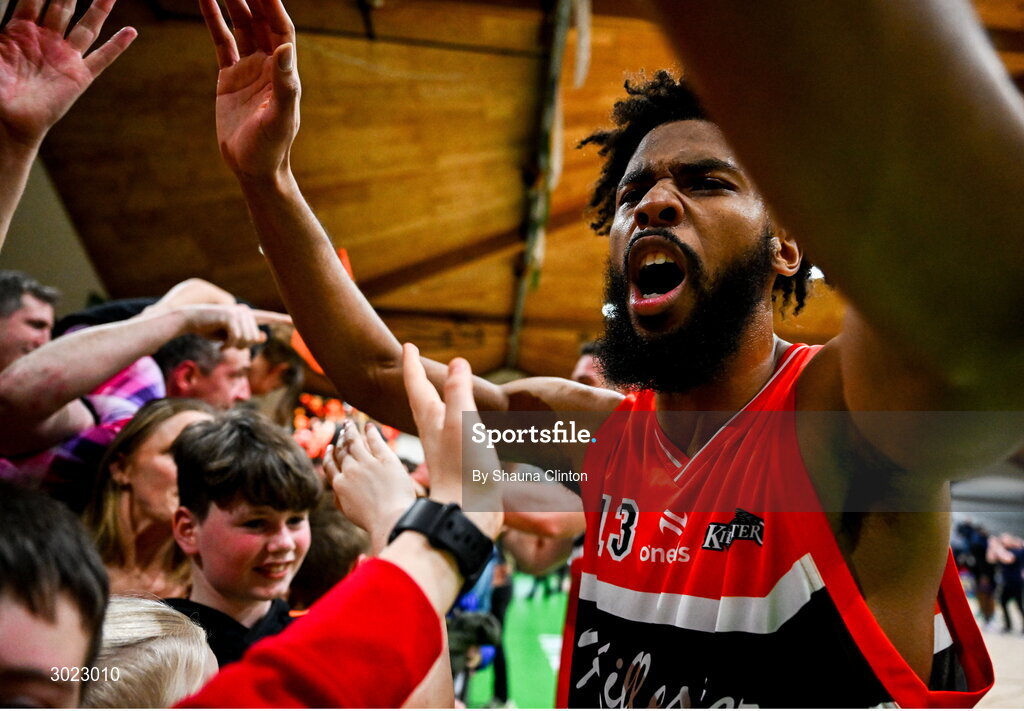 18 January 2025; Isiah Dasher of Killester celebrates with supporters after his side's victory in the Basketball Ireland Men's Pat Duffy National Cup final match between Killester and UCC Demons at the National Basketball Arena in Tallaght, Dublin. Photo by Shauna Clinton/Sportsfile
