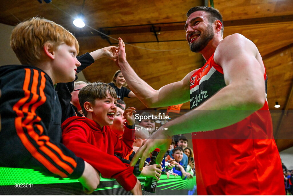 18 January 2025; Baptiste Chazelas of Killester celebrates with supporters after his side's victory in the Basketball Ireland Men's Pat Duffy National Cup final match between Killester and UCC Demons at the National Basketball Arena in Tallaght, Dublin. Photo by Shauna Clinton/Sportsfile