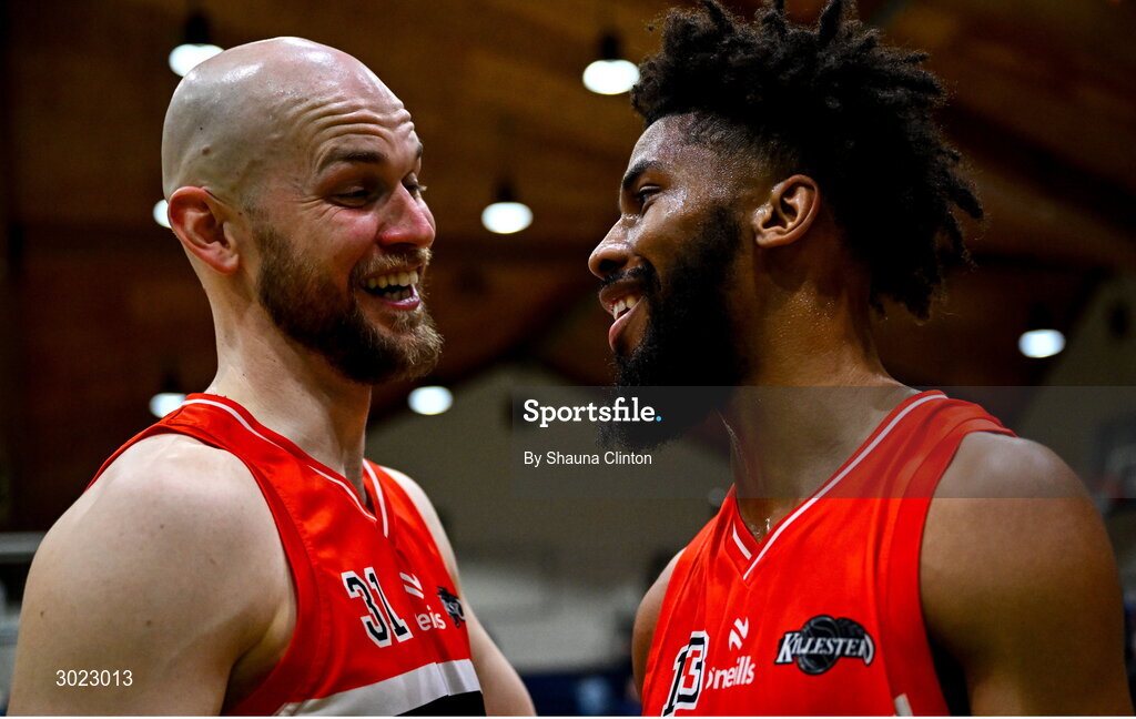 18 January 2025; Killester players Isiah Dasher, right, and Paul Dick celebrate after their side's victory in the Basketball Ireland Men's Pat Duffy National Cup final match between Killester and UCC Demons at the National Basketball Arena in Tallaght, Dublin. Photo by Shauna Clinton/Sportsfile