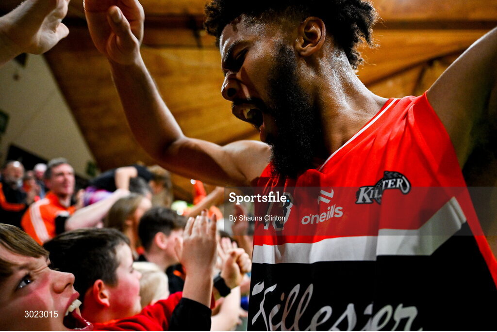 18 January 2025; Isiah Dasher of Killester celebrates with supporters after his side's victory in the Basketball Ireland Men's Pat Duffy National Cup final match between Killester and UCC Demons at the National Basketball Arena in Tallaght, Dublin. Photo by Shauna Clinton/Sportsfile