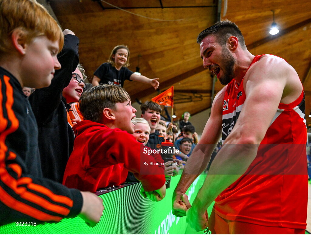 18 January 2025; Baptiste Chazelas of Killester celebrates with supporters after his side's victory in the Basketball Ireland Men's Pat Duffy National Cup final match between Killester and UCC Demons at the National Basketball Arena in Tallaght, Dublin. Photo by Shauna Clinton/Sportsfile