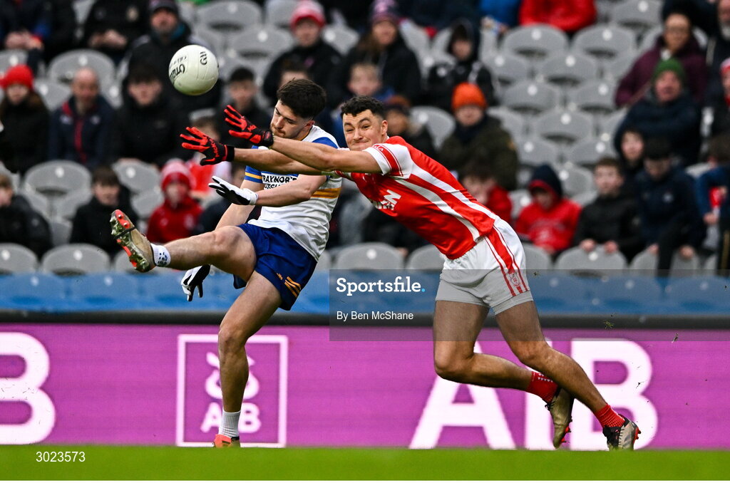 19 January 2025; Joe Oguz of Errigal Ciarán kicks a point despite the attention of Peter Duffy of Cuala during the AIB GAA Football All-Ireland Senior Club Championship final match between Cuala and Errigal Ciarán at Croke Park in Dublin. Photo by Ben McShane/Sportsfile