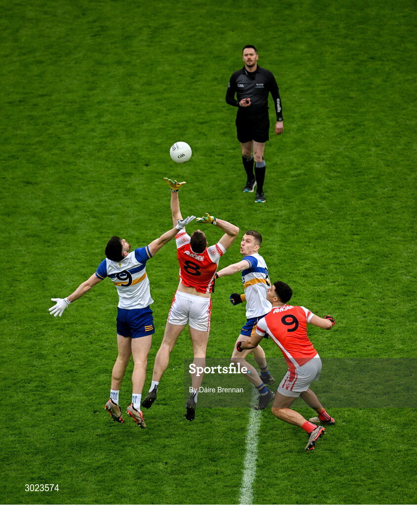 19 January 2025; Referee Paddy Neilan throws in the ball between Peadar Ó Cofaigh Byrne, left, and Peter Duffy of Cuala, and Joe Oguz, left, and Ben McDonnell of Errigal Ciarán to start the AIB GAA Football All-Ireland Senior Club Championship final match between Cuala and Errigal Ciarán at Croke Park in Dublin. Photo by Daire Brennan/Sportsfile