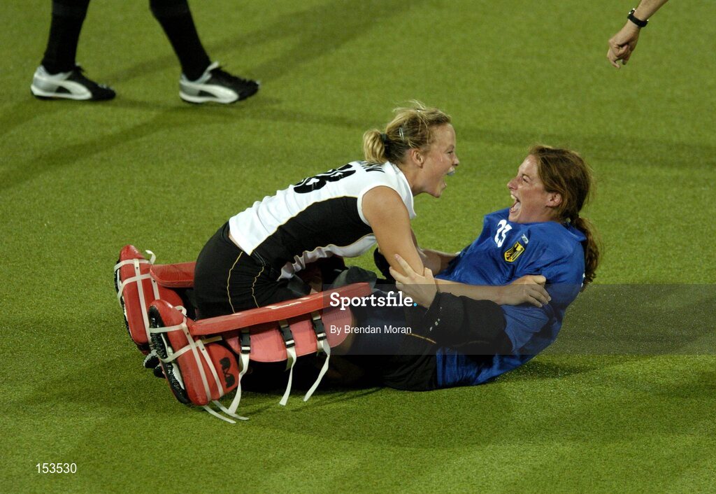 26 August 2004; Goalscorer Anke Kuehn, left, and substiture goalkeeper Julia Zwehl of Germany celebrate after victory over the Netherlands, Germany. Gold Medal Match, Netherlands v Germany, Olympic Hockey Centre, Helliniko Sports Complex. Games of the XXVIII Olympiad, Athens Summer Olympics Games 2004, Athens, Greece. Picture credit; Brendan Moran / SPORTSFILE