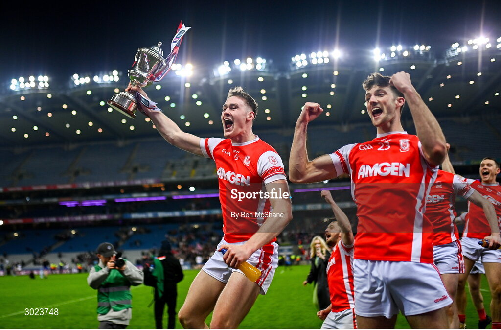 19 January 2025; Cuala players, Peadar Ó Cofaigh Byrne, left, and Cillian Dunne celebrate with the Andy Merrigan Cup after the AIB GAA Football All-Ireland Senior Club Championship final match between Cuala and Errigal Ciarán at Croke Park in Dublin. Photo by Ben McShane/Sportsfile