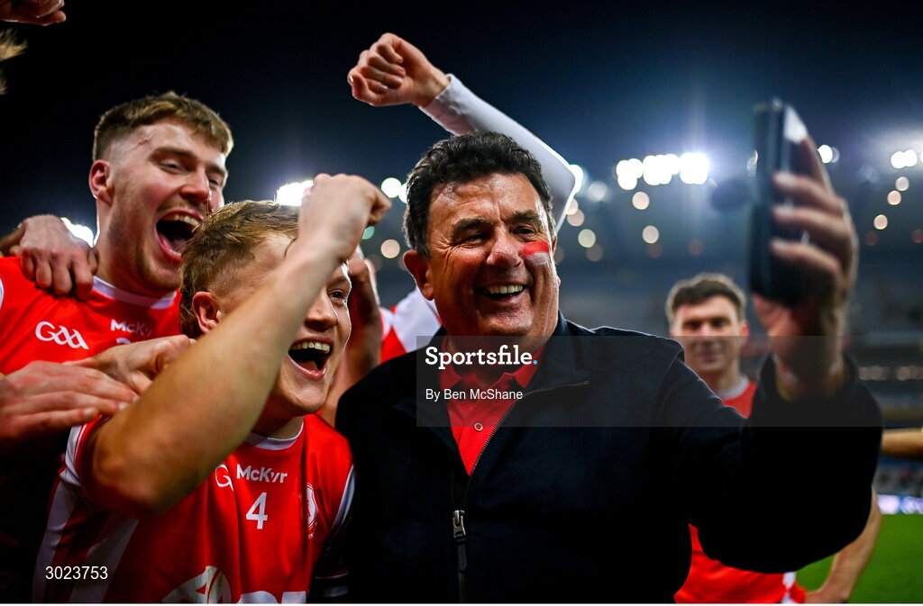 19 January 2025; Cuala supporter Des Cahill celebrates with the Cuala players after their victory in the AIB GAA Football All-Ireland Senior Club Championship final match between Cuala and Errigal Ciarán at Croke Park in Dublin. Photo by Ben McShane/Sportsfile