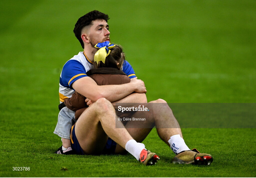 19 January 2025; A dejected Joe Oguz of Errigal Ciarán with his daughter Ada, aged 3, after the AIB GAA Football All-Ireland Senior Club Championship final match between Cuala and Errigal Ciarán at Croke Park in Dublin. Photo by Daire Brennan/Sportsfile