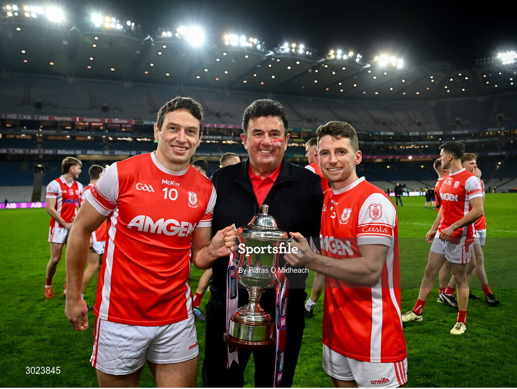 19 January 2025; Cuala supporter Des Cahill with James Power, left, and Luke Keating as they celebrate with the Andy Merrigan Cup after the AIB GAA Football All-Ireland Senior Club Championship final match between Cuala and Errigal Ciarán at Croke Park in Dublin. Photo by Piaras Ó Mídheach/Sportsfile