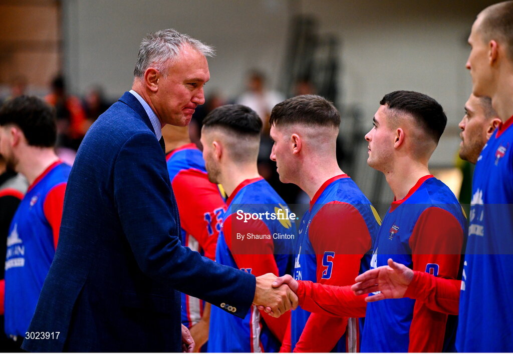 18 January 2025; FIBA executive director Kamil Novak shakes hands with UCC Demons players before the Basketball Ireland Men's Pat Duffy National Cup final match between Killester and UCC Demons at the National Basketball Arena in Tallaght, Dublin. Photo by Shauna Clinton/Sportsfile