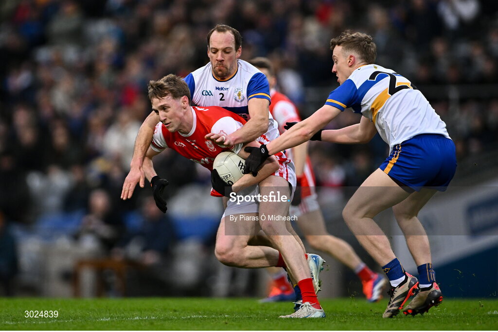 19 January 2025; Eoin Kennedy of Cuala in action against Ciaran Quinn and Mark Kavanagh, right, of Errigal Ciarán during the AIB GAA Football All-Ireland Senior Club Championship final match between Cuala and Errigal Ciarán at Croke Park in Dublin. Photo by Piaras Ó Mídheach/Sportsfile