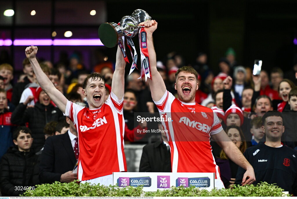 19 January 2025; Cuala players Eoin Kennedy, left, and Tom Magee lift the Andy Merrigan Cup after their side's victory in the the AIB GAA Football All-Ireland Senior Club Championship final match between Cuala and Errigal Ciarán at Croke Park in Dublin. Photo by Ben McShane/Sportsfile