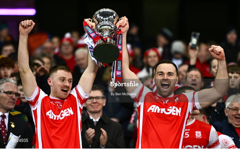 19 January 2025; Cuala players Cathal Ó Giolláin, left, and Luke Tracey lift the Andy Merrigan Cup after their side's victory in the the AIB GAA Football All-Ireland Senior Club Championship final match between Cuala and Errigal Ciarán at Croke Park in Dublin. Photo by Ben McShane/Sportsfile