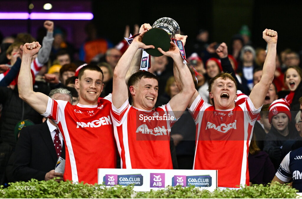 19 January 2025; Cuala players, from left, Con O'Callaghan, Niall O'Callaghan and Eoghan O'Callaghan lift the Andy Merrigan Cup after their side's victory in the the AIB GAA Football All-Ireland Senior Club Championship final match between Cuala and Errigal Ciarán at Croke Park in Dublin. Photo by Ben McShane/Sportsfile