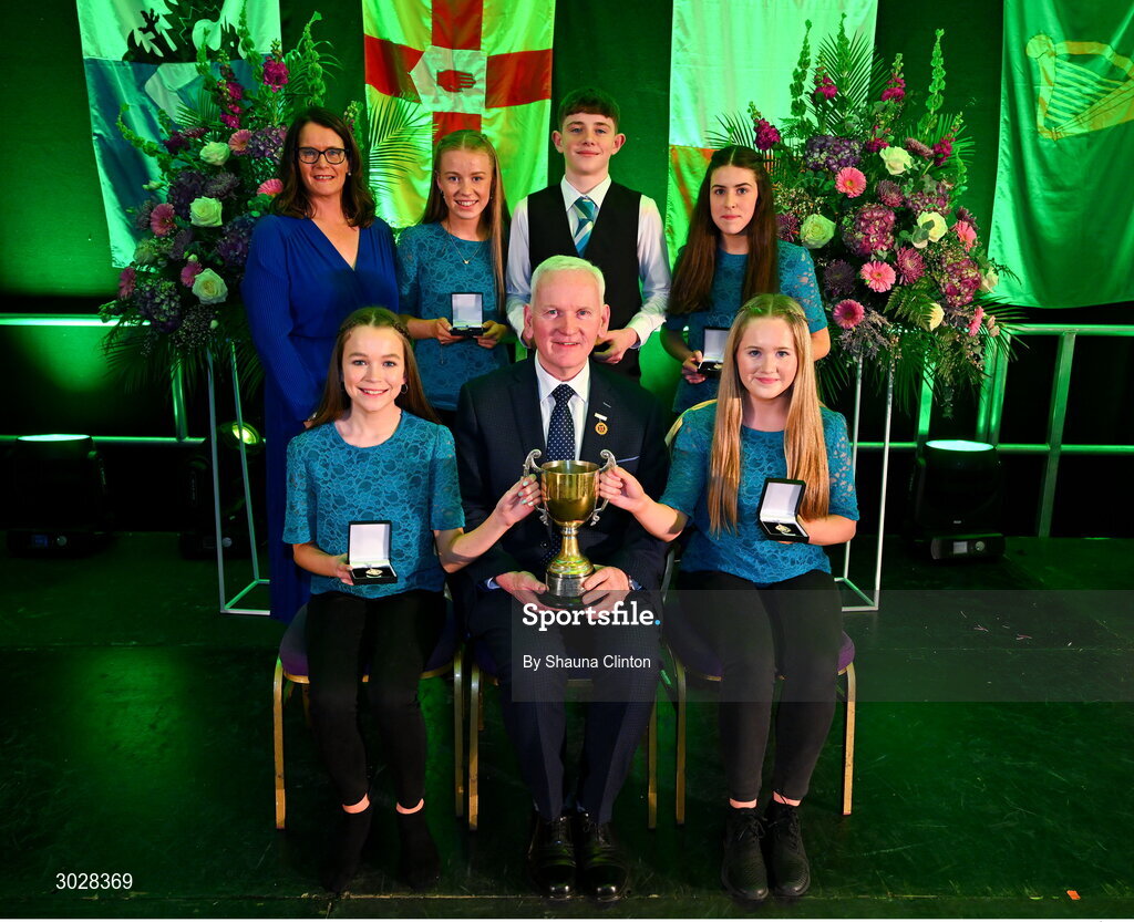 25 January 2025; Winners of the Ceol Uirlise competition, The Baile Chláir team, including Orna McCormack, Emily Feery Quinn, Ashlynn O’Sullivan, Erin Finnerty and Fionn Herwood, representing Galway and Connacht, with Uachtarán Chomhairle Uladh C.L.G Micheál Mag Eochagáin and Cathaoirleach Coiste Náisiúnta Scór Paula Magee during the Scór na nÓg 2024-25 All-Ireland Finals at the Hillgrove Hotel, Monaghan. Photo by Shauna Clinton/Sportsfile