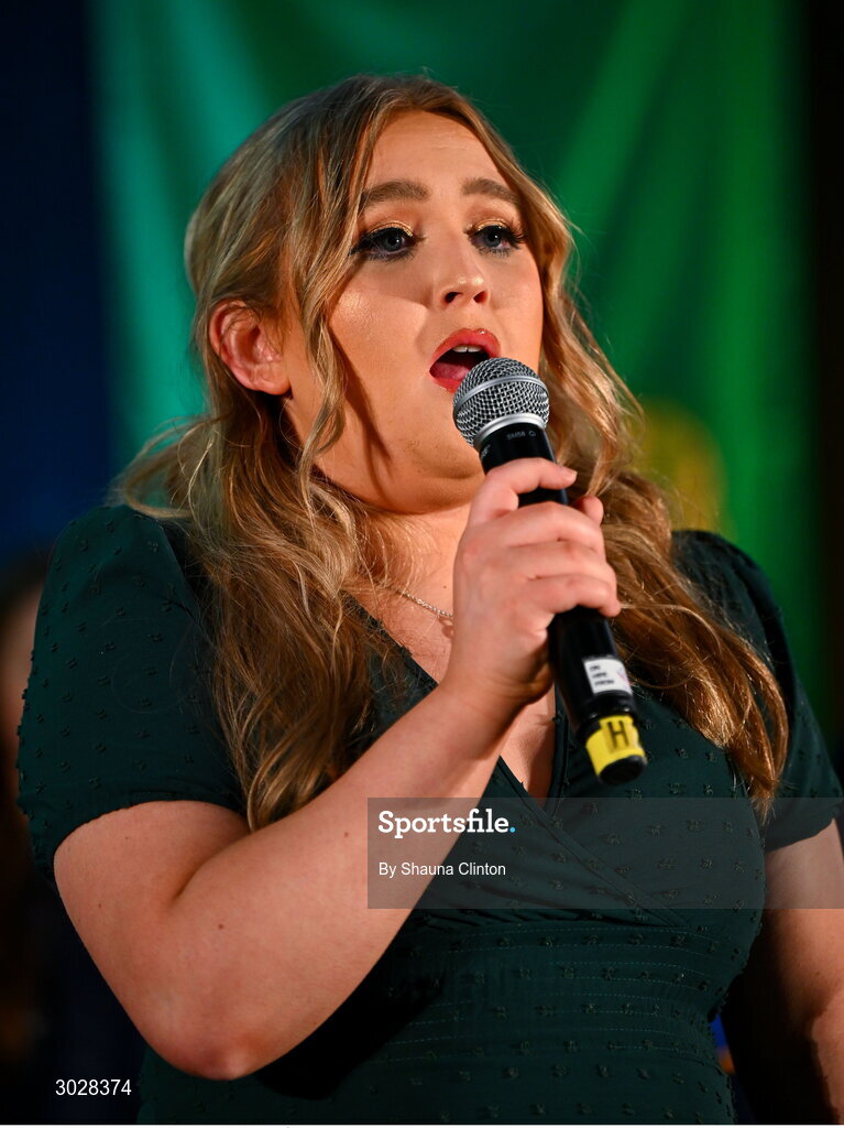 25 January 2025; Katie Boyle sings Amhrán na bhFiann before the the Scór na nÓg 2024-25 All-Ireland Finals at the Hillgrove Hotel, Monaghan. Photo by Shauna Clinton/Sportsfile