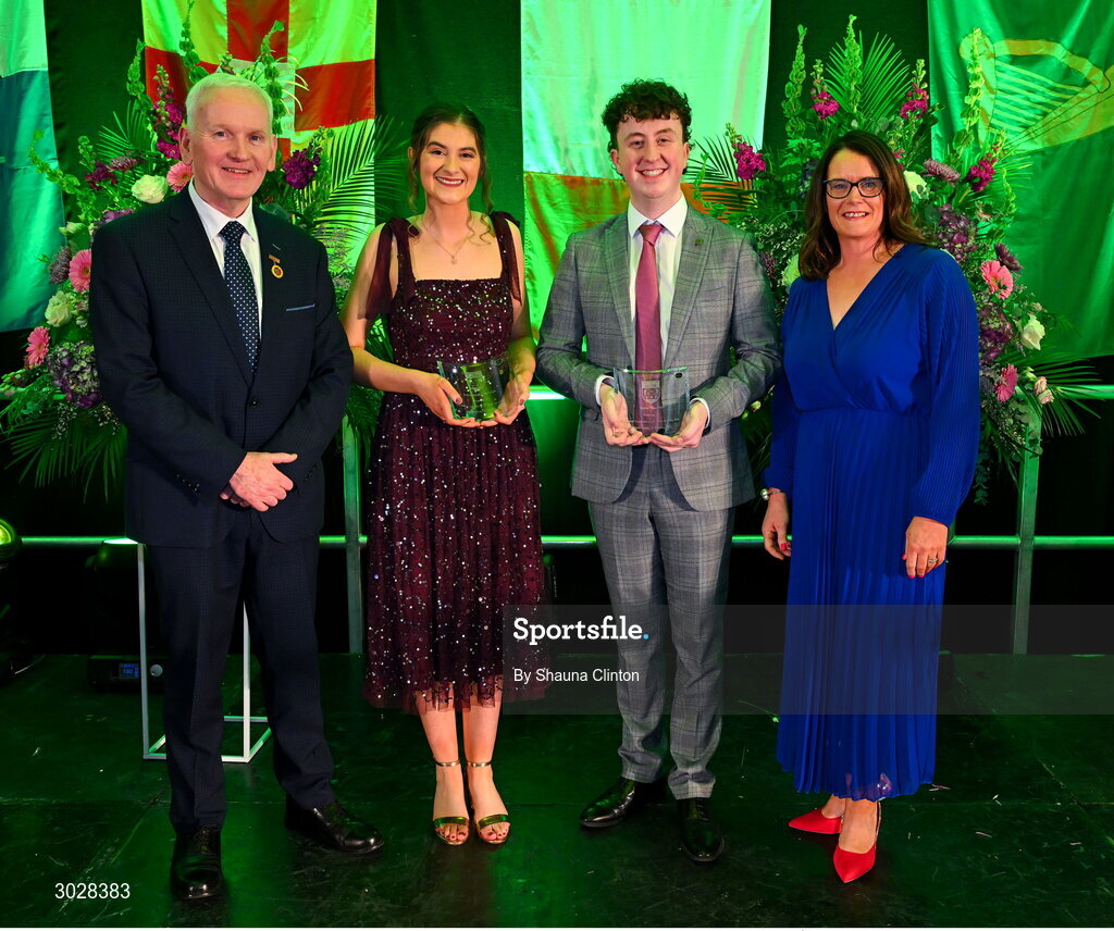 25 January 2025; Bean an Tí Bláthnaid Ní Dhálaigh, centre left, and Fear an Tí Ethan Mac Né, centre right, with Uachtarán Chomhairle Uladh C.L.G Micheál Mag Eochagáin and Cathaoirleach Coiste Náisiúnta Scór Paula Magee during the Scór na nÓg 2024-25 All-Ireland Finals at the Hillgrove Hotel, Monaghan. Photo by Shauna Clinton/Sportsfile