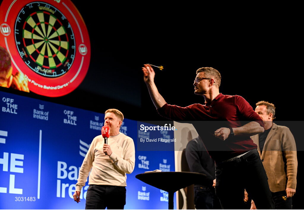 29 January 2025; Former Ireland and Leinster rugby player Brian O'Driscoll playing darts during a special Off the Ball Roadshow event at the Olympia Theatre in Dublin. Photo by David Fitzgerald/Sportsfile
