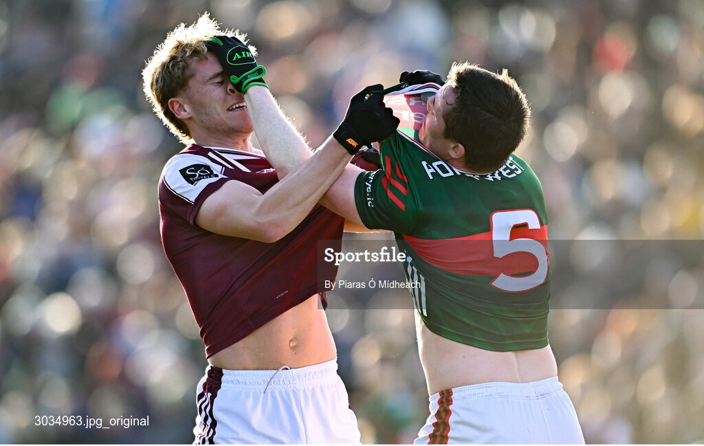 2 February 2025; Sam O'Neill of Galway and Stephen Coen of Mayo tussle off the ball, before both were shown the yellow card by referee Noel Mooney, during the Allianz Football League Division 1 match between Mayo and Galway at Hastings Insurance MacHale Park in Castlebar, Mayo. Photo by Piaras Ó Mídheach/Sportsfile