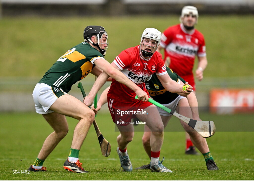 9 February 2025; Padhraig Neilis of Derry is tackled by Ronan Walsh and Oisín Maunsell of Kerry during the Allianz Hurling League Division 2 match between Kerry and Derry at Austin Stack Park in Tralee, Kerry. Photo by Brendan Moran/Sportsfile