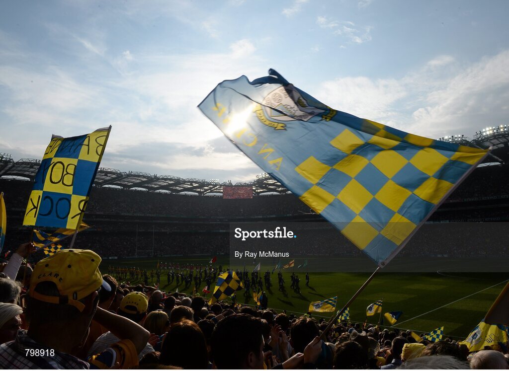 28 September 2013; Clare supporters wave flags during the pre-match parade. GAA Hurling All-Ireland Senior Championship Final Replay, Cork v Clare, Croke Park, Dublin. Picture credit: Ray McManus / SPORTSFILE