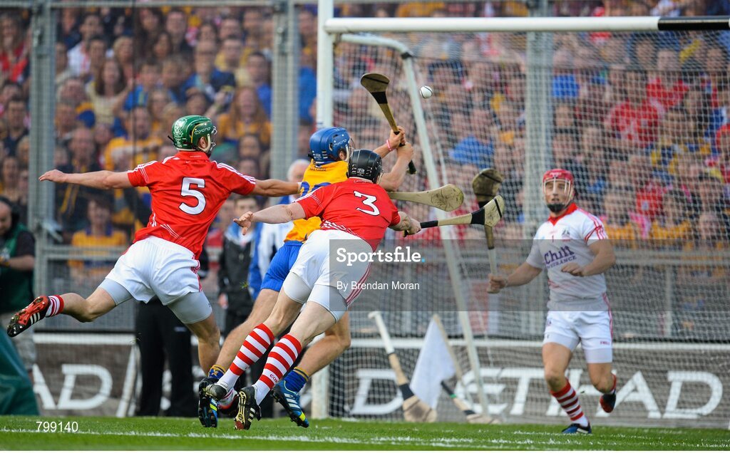 28 September 2013; Shane O'Donnell, Clare, scores his and his side's third goal despite the best efforts of Brian Murphy, 5, and Shane O'Neill, Cork. GAA Hurling All-Ireland Senior Championship Final Replay, Cork v Clare, Croke Park, Dublin. Picture credit: Brendan Moran / SPORTSFILE