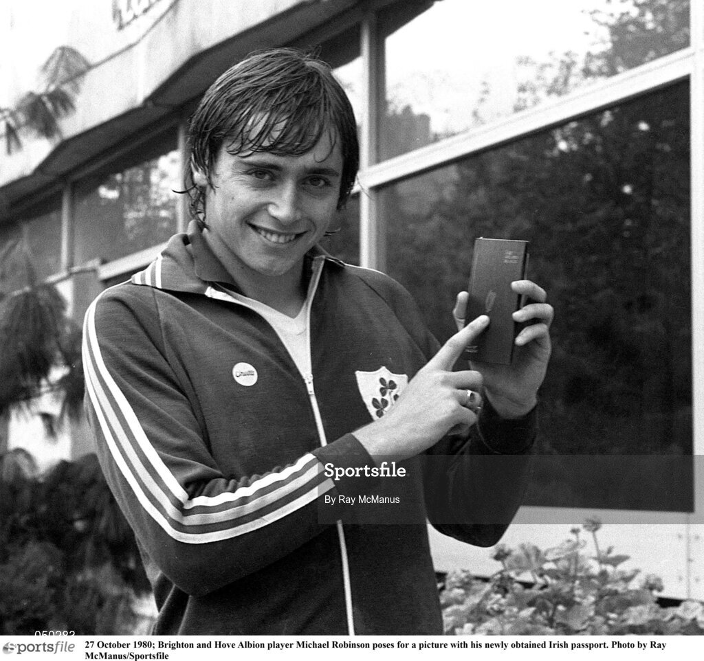 27 October 1980; Brighton and Hove Albion player Michael Robinson poses for a picture with his newly obtained Irish passport. Photo by Ray McManus/Sportsfile