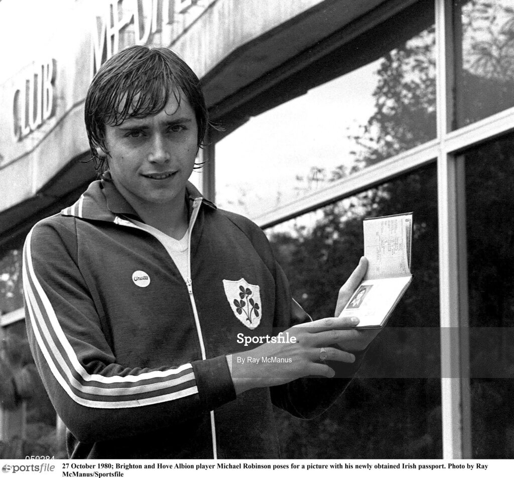 27 October 1980; Brighton and Hove Albion player Michael Robinson poses for a picture with his newly obtained Irish passport. Photo by Ray McManus/Sportsfile