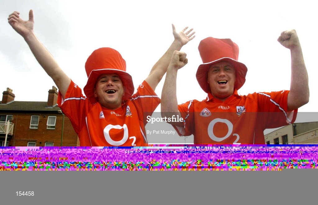 12 September 2004; Cork fans Don Walsh and Jim Walsh, right, show their support before the game. Guinness All-Ireland Senior Hurling Championship Final, Cork v Kilkenny, Croke Park, Dublin. Picture credit; Pat Murphy / SPORTSFILE *** Local Caption *** Any photograph taken by SPORTSFILE during, or in connection with, the 2004 Guinness All-Ireland Hurling Final which displays GAA logos or contains an image or part of an image of any GAA intellectual property, or, which contains images of a GAA player/players in their playing uniforms, may only be used for editorial and non-advertising purposes.  Use of photographs for advertising, as posters or for purchase separately is strictly prohibited unless prior written approval has been obtained from the Gaelic Athletic Association.