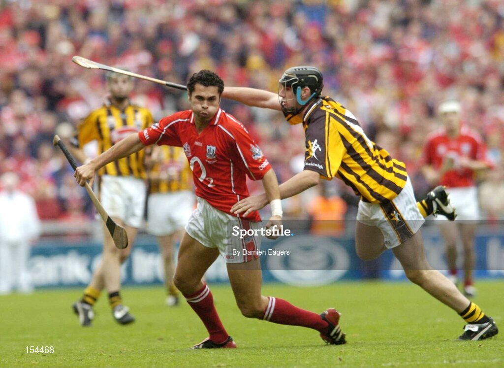 12 September 2004; Sean Og O'hAilpin, Cork, in action against John Hoyne, Kilkenny. Guinness All-Ireland Senior Hurling Championship Final, Cork v Kilkenny, Croke Park, Dublin. Picture credit; Damien Eagers / SPORTSFILE *** Local Caption *** Any photograph taken by SPORTSFILE during, or in connection with, the 2004 Guinness All-Ireland Hurling Final which displays GAA logos or contains an image or part of an image of any GAA intellectual property, or, which contains images of a GAA player/players in their playing uniforms, may only be used for editorial and non-advertising purposes.  Use of photographs for advertising, as posters or for purchase separately is strictly prohibited unless prior written approval has been obtained from the Gaelic Athletic Association.