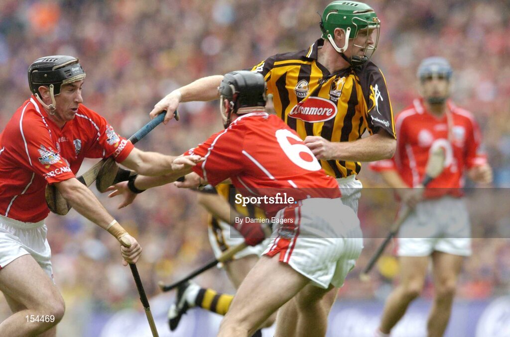12 September 2004; Henry Shefflin, Kilkenny, in action against Ronan Curran, (6), and John Gardiner, Cork. Guinness All-Ireland Senior Hurling Championship Final, Cork v Kilkenny, Croke Park, Dublin. Picture credit; Damien Eagers / SPORTSFILE *** Local Caption *** Any photograph taken by SPORTSFILE during, or in connection with, the 2004 Guinness All-Ireland Hurling Final which displays GAA logos or contains an image or part of an image of any GAA intellectual property, or, which contains images of a GAA player/players in their playing uniforms, may only be used for editorial and non-advertising purposes.  Use of photographs for advertising, as posters or for purchase separately is strictly prohibited unless prior written approval has been obtained from the Gaelic Athletic Association.