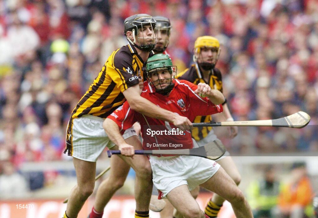 12 September 2004; Jerry O'Connor, Cork, in action against John Hoyne, Kilkenny. Guinness All-Ireland Senior Hurling Championship Final, Cork v Kilkenny, Croke Park, Dublin. Picture credit; Damien Eagers / SPORTSFILE *** Local Caption *** Any photograph taken by SPORTSFILE during, or in connection with, the 2004 Guinness All-Ireland Hurling Final which displays GAA logos or contains an image or part of an image of any GAA intellectual property, or, which contains images of a GAA player/players in their playing uniforms, may only be used for editorial and non-advertising purposes.  Use of photographs for advertising, as posters or for purchase separately is strictly prohibited unless prior written approval has been obtained from the Gaelic Athletic Association.