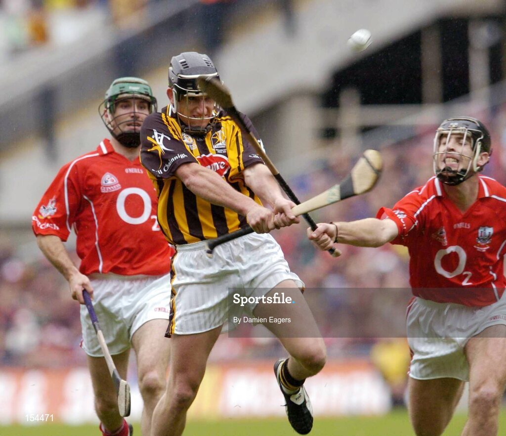 12 September 2004; Derek Lyng, Kilkenny, in action against Ronan Curran, Cork. Guinness All-Ireland Senior Hurling Championship Final, Cork v Kilkenny, Croke Park, Dublin. Picture credit; Damien Eagers / SPORTSFILE *** Local Caption *** Any photograph taken by SPORTSFILE during, or in connection with, the 2004 Guinness All-Ireland Hurling Final which displays GAA logos or contains an image or part of an image of any GAA intellectual property, or, which contains images of a GAA player/players in their playing uniforms, may only be used for editorial and non-advertising purposes.  Use of photographs for advertising, as posters or for purchase separately is strictly prohibited unless prior written approval has been obtained from the Gaelic Athletic Association.