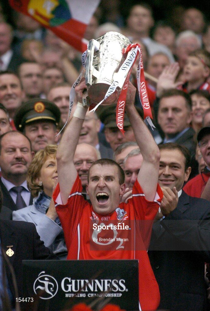 12 September 2004; Cork captain Ben O'Connor lifts the Liam MacCarthy cup after victory over Kilkenny. Guinness All-Ireland Senior Hurling Championship Final, Cork v Kilkenny, Croke Park, Dublin. Picture credit; Brendan Moran / SPORTSFILE *** Local Caption *** Any photograph taken by SPORTSFILE during, or in connection with, the 2004 Guinness All-Ireland Hurling Final which displays GAA logos or contains an image or part of an image of any GAA intellectual property, or, which contains images of a GAA player/players in their playing uniforms, may only be used for editorial and non-advertising purposes.  Use of photographs for advertising, as posters or for purchase separately is strictly prohibited unless prior written approval has been obtained from the Gaelic Athletic Association.